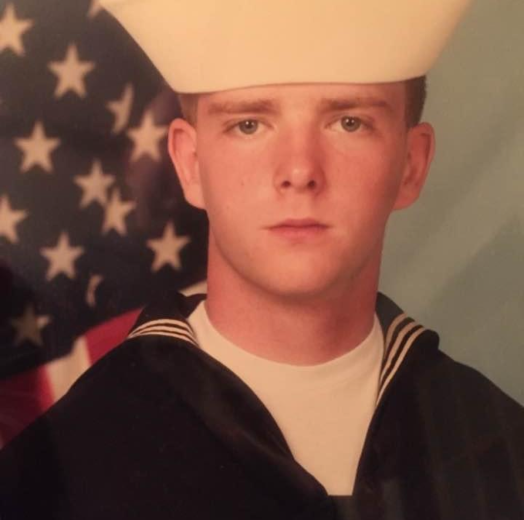 Dan Powell wearing a United States Navy Dress Blues Uniform. Home Watch Rochester.